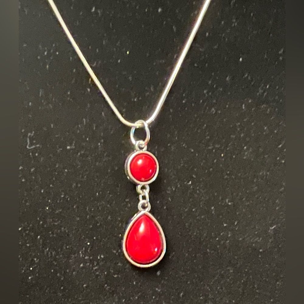 Upcycled jewelry. Beautiful pendant with red stone on silver tone chain